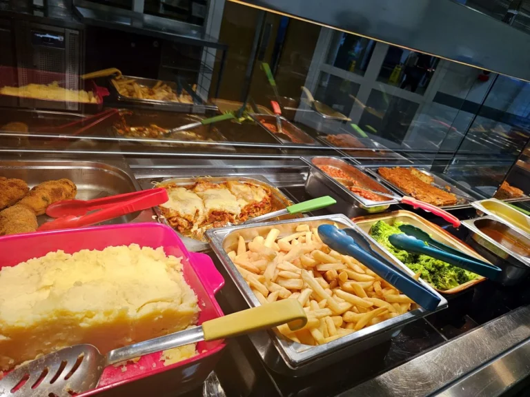 Lunch service with fish, chips, mash and broccoli